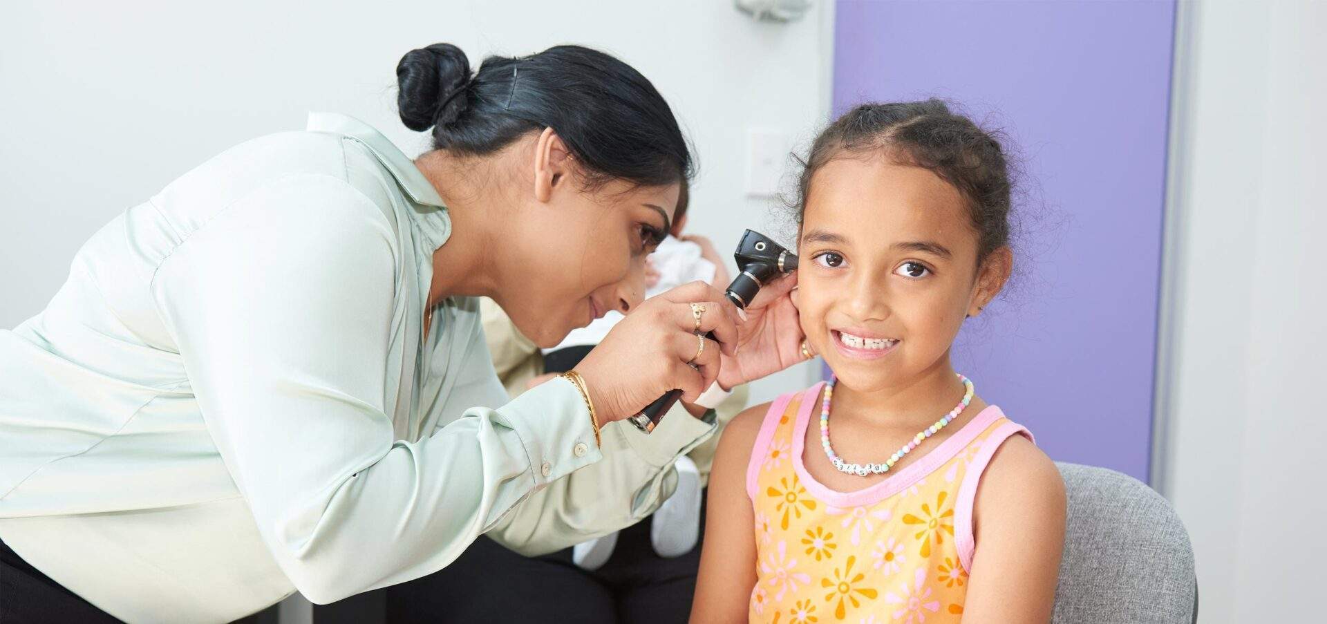 Young girl getting a medical check up by a female doctor